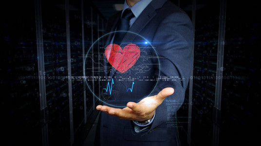 穿着西装的商人用控制论的心脏符号全息图触摸屏幕在虚拟显示器上使用手的人爱情网络约会浪漫健康和心脏病学的背景图片