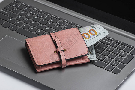 网上购物最低点概念在笔记本电脑键盘上用美元图片