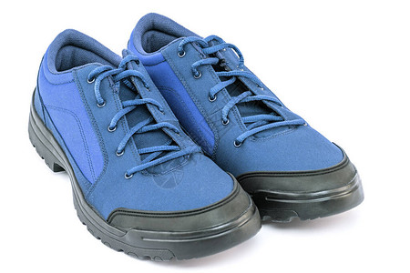 一双蓝色的廉价耐用织物旅行鞋被图片