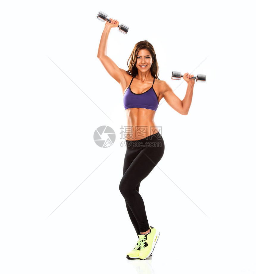 美丽健康的女人锻炼与重量图片