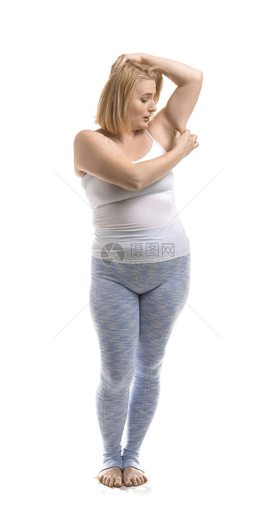 在白色背景上陷入困境的超重女人图片