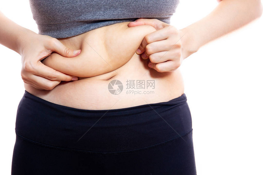 不健康的胖女人紧地抓住她的肚子孤立图片