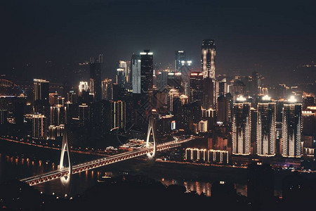 重庆市的桥梁和城市建筑晚背景图片