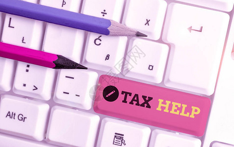手写文本书写税务帮助对收入的强制贡献的概念照片援助白色pc键盘图片