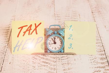 手写文本书写税务帮助对收入的强制贡献的概图片
