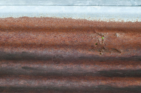 Rusty锌背景粗金刚石生锈和图片