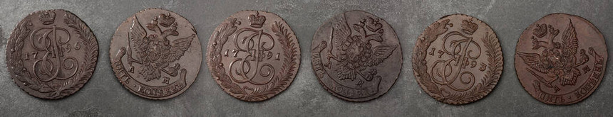 古老的收集硬币在木制桌子上制造铜图片