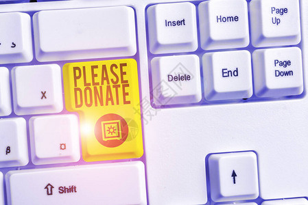 手写文本请捐赠概念照片供应家具分发捐赠款援助给慈善机构白色pc键盘图片