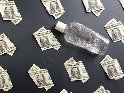 美国一美元钞票和一瓶黑底的图片