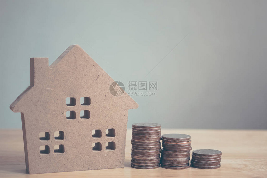 财产投资和住房抵押贷款金融概念住房模式和现成硬币作为金融和银行业图片