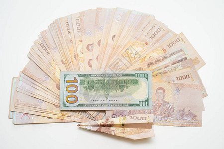 泰币1000铢和100美元泰国钞票背景图片