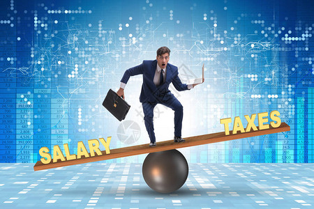 平衡税收与薪金的商人在税务与工资图片