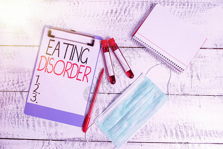 概念手写显示饮食失调概念意味着疾病或饮食行为中的严重干扰血样小瓶医疗图片