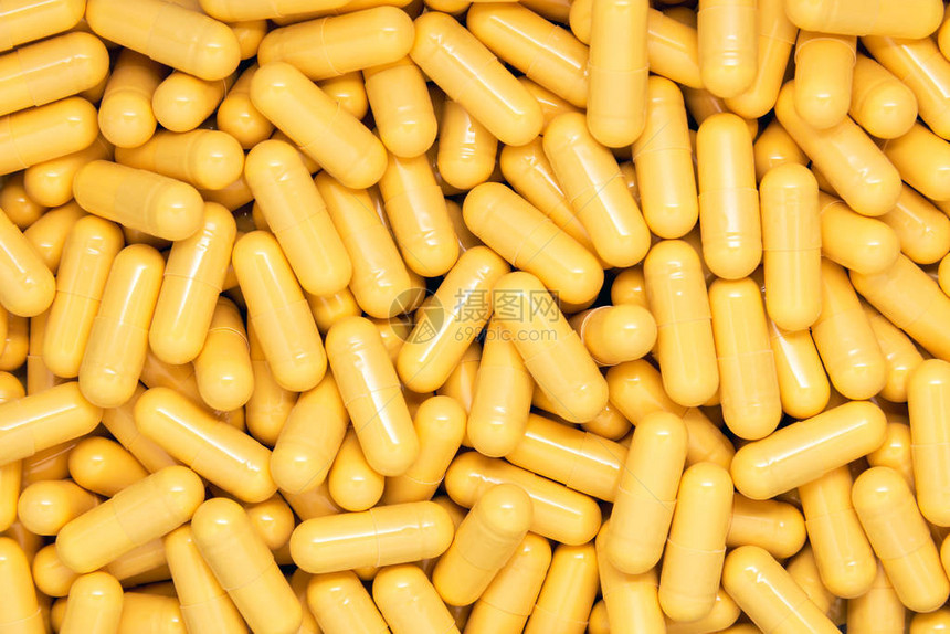 黄色药物胶囊背景图片