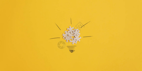 思想和创新的概念图像由谜题拼图和手画光线组成的灯泡在黄色背景上图片