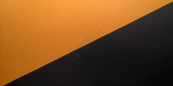 混凝土墙涂成橙色和黑色图片