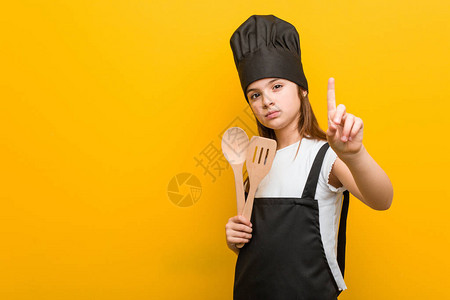 小caucasian女孩穿着厨师服装展图片