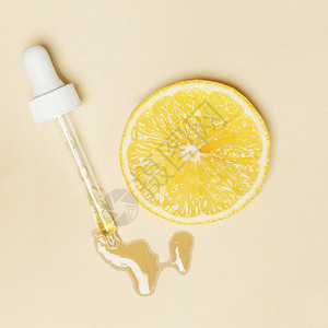 柠檬精油滴管吸和柠檬片图片