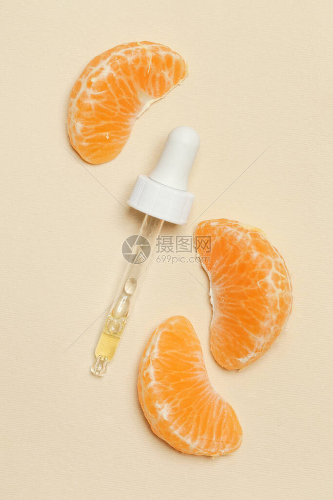 橘子精油滴管吸和橘子片图片