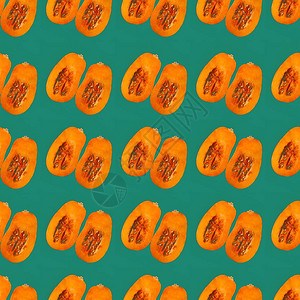 南瓜香料甜甜圈绿松石背景上的南瓜无缝图案两半南瓜创意极简主义设计图片