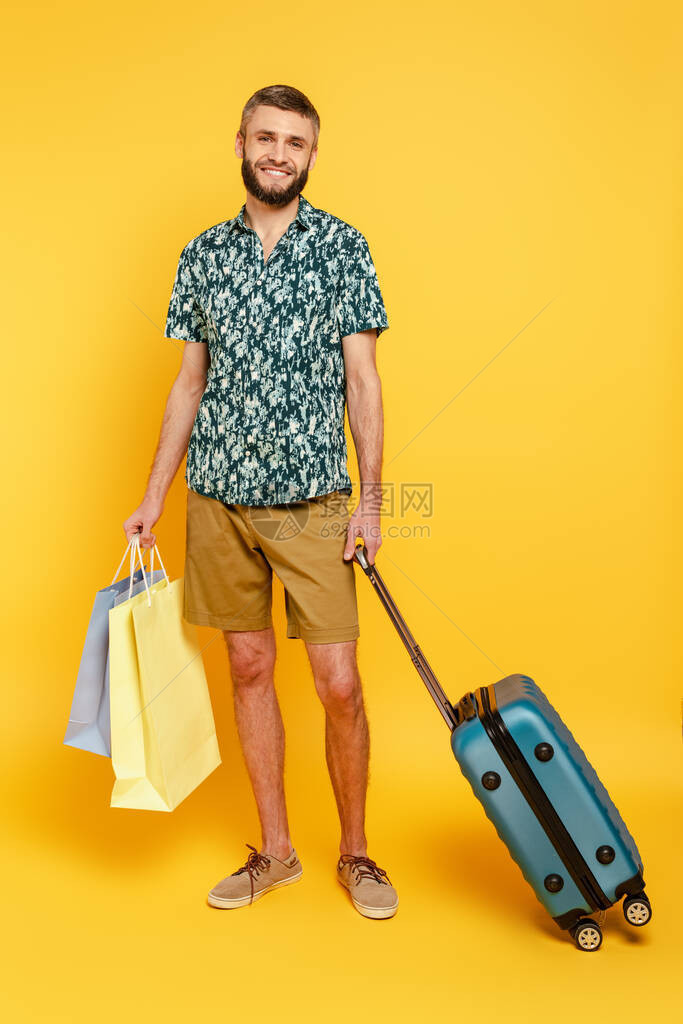 满的画面快乐胡子的家伙带着手提箱和购图片