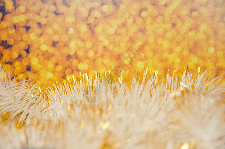 新年背景金色属箔与抽象模糊的金色背景相映成趣图片