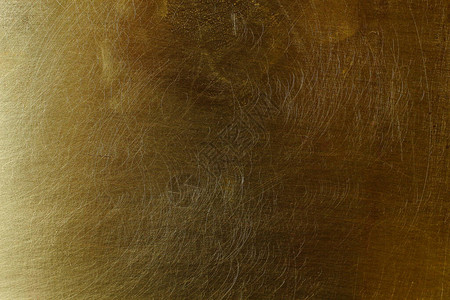旧黄铜的划伤纹理表面背景图片