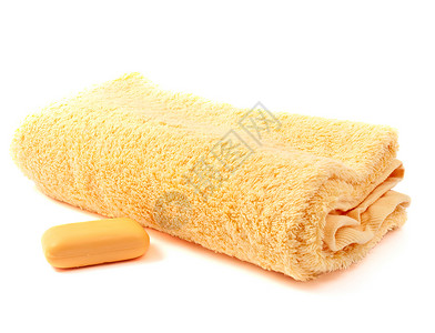 白色背景中的黄色毛巾和肥皂图片