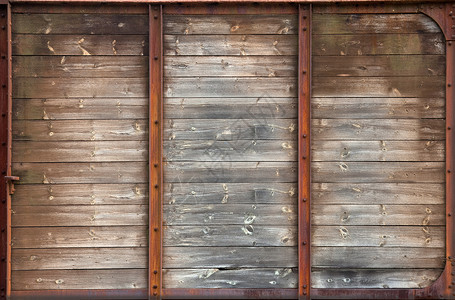 生锈的金属框架纹理的旧木墙图片