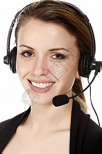 美丽的顾客服务经营人戴耳机的妇女白图片