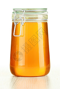 大罐蜂蜜上白色孤立图片