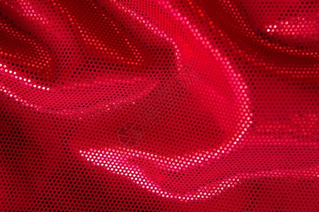 红色织物背景与闪亮的小亮片图片