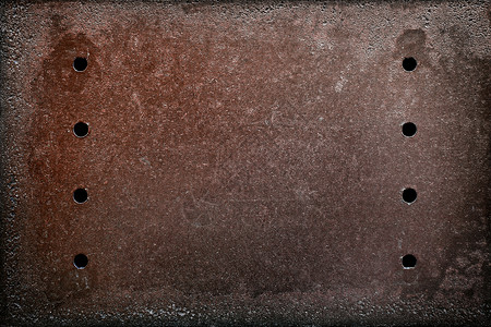 生锈的旧铁表面有孔图片