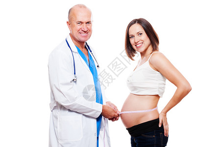 测量孕妇胃部的微笑医生图片