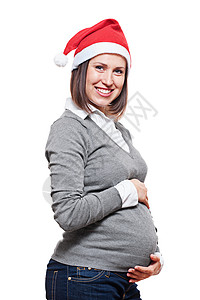 身戴圣塔帽的幸福孕妇在白色图片
