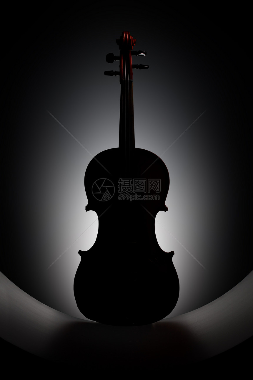 黑色背景上的小提琴剪影图片