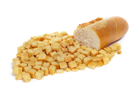 一堆面包和一块面包放在白底图片