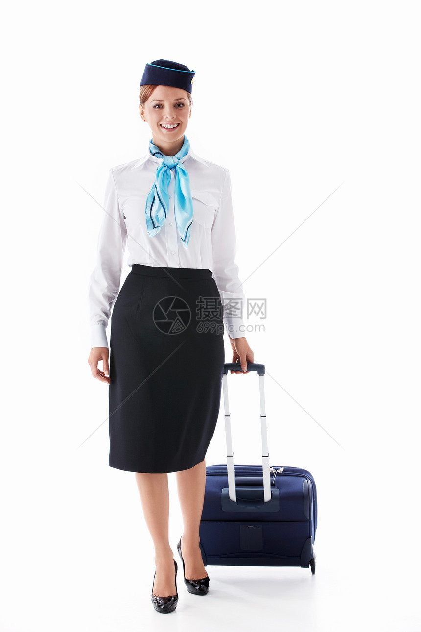 白色背景中提着手提箱的空姐图片