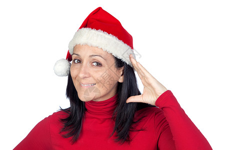戴着圣诞帽子的漂亮女人以聆听白人的歌声为姿势图片