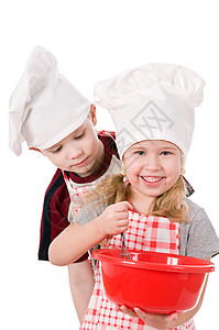 两个戴着厨师帽子的孩子孤立图片