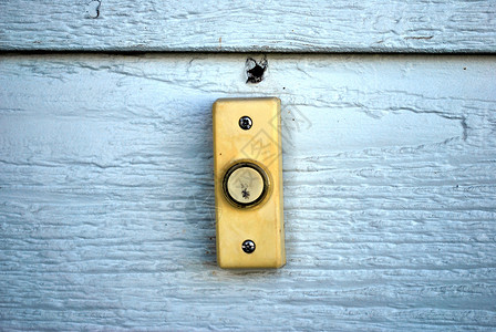 房子外墙上的门铃背景图片