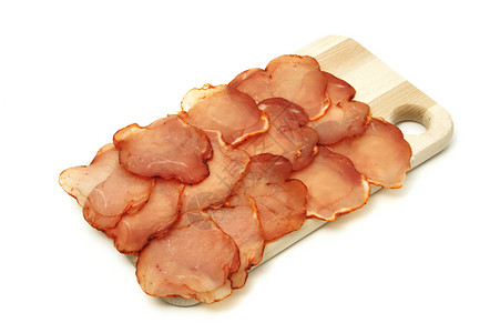 几片腌制猪里脊放在板上图片