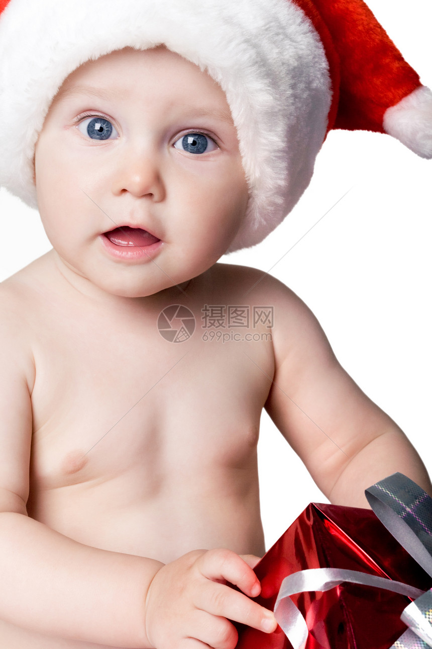 穿着圣诞老人帽子的可爱小男孩的肖像图片