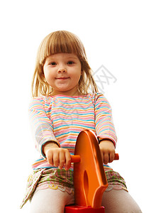 骑着玩具马的小女孩仰图片