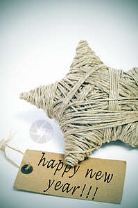 圣诞星用麻绳和新年快乐的句子制作在图片