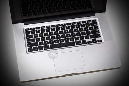 笔记本电脑键盘灰色中央光点背景图片