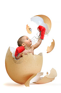 美丽的婴儿打破蛋壳图片