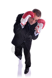 一个戴着拳击手套的防守姿势的商人的形象图片