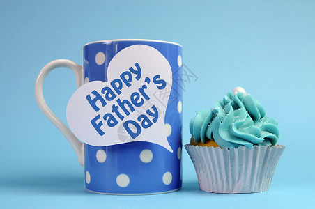 父亲节快乐特别款待蓝色和白色装饰精美的纸杯蛋糕图片
