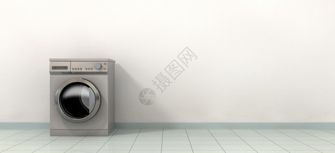 一台普通刷洗金属洗衣机在空瓷砖图片